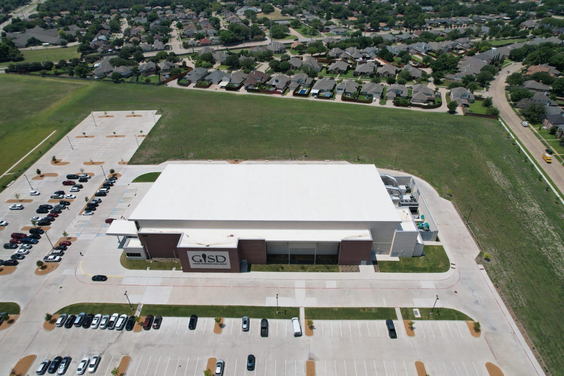 White TPO membrane roof on a school district facility